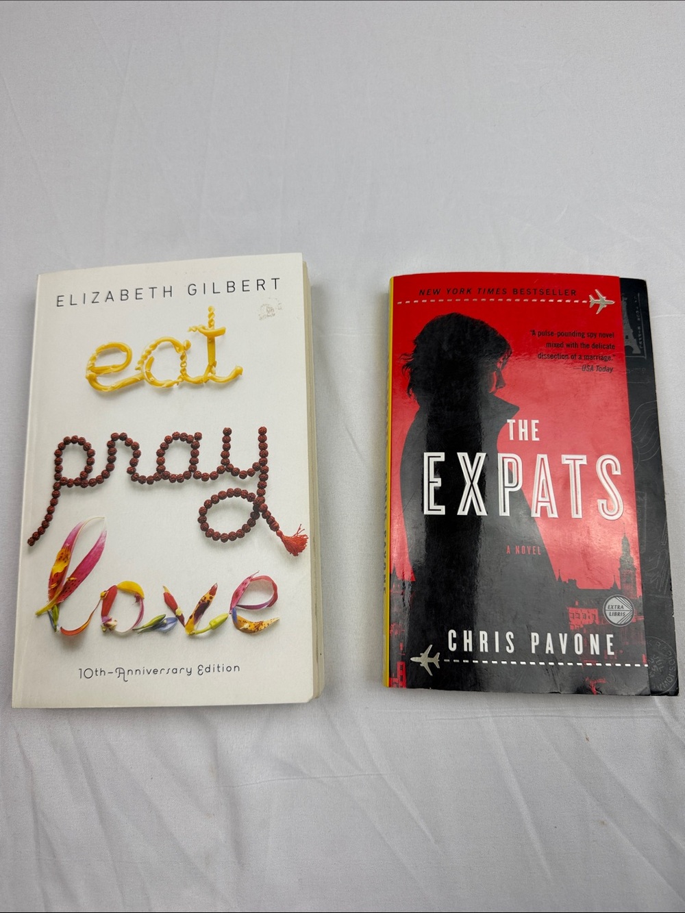“The Expats”by Chris Pavone & “Eat Pray Love” by Elizabeth Gilbert